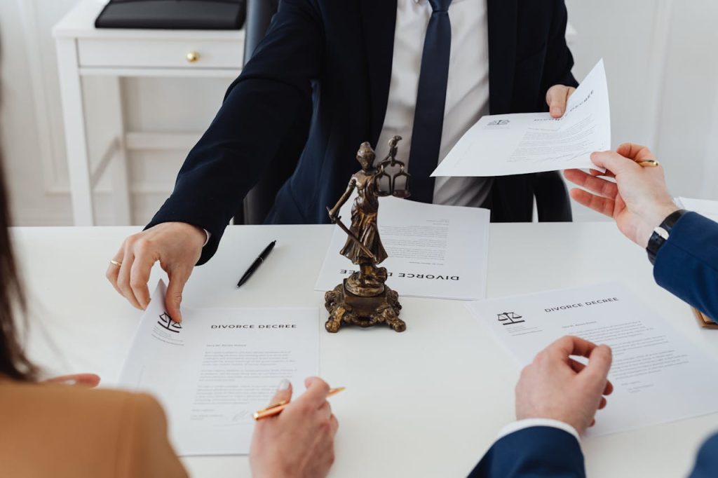 people-holding-divorce-papers-7876051